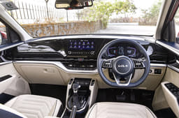 Kia Carens High-quality interior gets a dual-tone navy blue and cream upholstery.